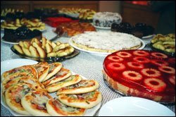 To top off the reporter's visit, teachers at the Al-Khansa'a School prepared an inviting spread of snacks and sweets, including a cake topped with red gelatin and pineapple rings.
