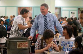 Principal Paul Marshall helps pick up trash at the end of lunch at B.M.C. Durfee High School. Marshall and other staff members have made a significant effort to change the culture at the school.