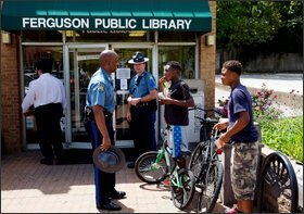 Missouri Highway Patrol Captain Ron Johnson visits the Ferguson Public Library and talks with area students.