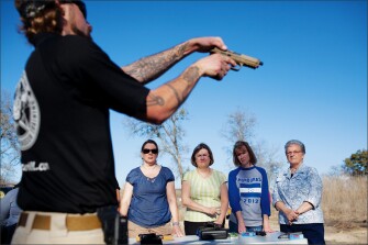 Instructors from Big Iron Concealed Handgun Training in Waco, Texas, give teachers tips on what they need to know to earn a license to carry weapons out of sight.
