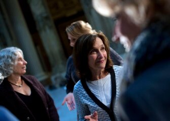 Marilyn Russell of The Carnegie Museum, center, chats with Jennifer Beagan of the Allegheny Intermediate Unit, during a photo shoot in the Hall of Architecture at the Carnegie Museum of Pittsburgh. In the background are Mary Frances Cooper of the Carnegie Library, left, and Sue Polojac of the Pittsburgh Association for the Education of Young Children.