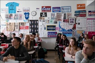 Students listen to teacher Michael Siraguse while he explains the results of 2018 midterms elections during an AP U.S. Government class at John Handley High School.