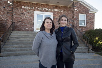 From left, Amy and Olivia Carson pictured outside Bangor Christian School in Bangor, Maine on Nov. 5, 2021.