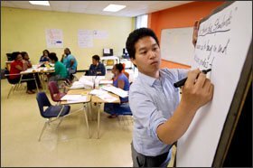 Teacher coach Peter Tang leads part of a three-day Common Core State Standards training session at Ridgeway High School in Memphis, Tenn., paid for through Race to the Top grant money. Mr. Tang is one of 700 teachers trained by the state to help other teachers develop a mindset for implementing the new standards.