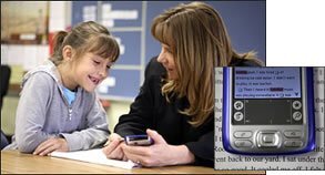 Mountainview Elementary's reading coach, Tonya S. Newton, talks with 6-year-old Alyssa Adams about the oral-fluency gains that the 1st grader has made on a one-minute reading test given on a hand-held computer. "She blew my socks off!" Ms. Newton said about Alyssa.
