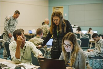 Puerto Rico Education Secretary Julia Keleher works at her makeshift headquarters in the convention center in San Juan, trying to find out information about the state of the nearly 1,200 schools in the U.S. territory.