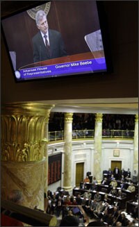 Arkansas Gov. Mike Beebe's image is shown on a television monitor in the state Capitol in Little Rock during his State of the State speech.