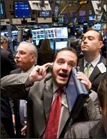 Trader Tom Kalikas, center, works on the floor of the New York Stock Exchange on Sept. 17, a day on which stock prices plummeted.