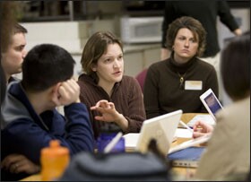 Team leader Heather Brown talks with her algebra colleagues. Topics vary from session to session, with the overall goal of helping students succeed.