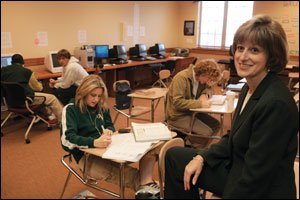 Despite critics' claims that Villages High only produces consumers, former business teacher Cindi Van Nostrand says, "The students are learning real-world skills and a level of critical thinking."
