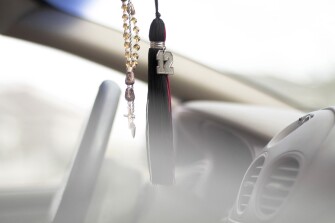 A tassel, which Cheyenne Central High School senior Deondre Davis plans on wearing when he graduates this May, hangs from the rearview mirror of his car.