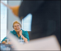 Joyce L. Conrad, 79, the executive director of Organizations Concerned about Rural Education, listens as a featured speaker talks to the group during its July meeting.