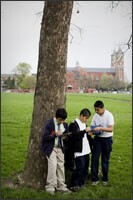 Anthony Suarez, left, Diego Calzada, and Daniel Gonzalez collect and enter data from observations the Academy of the Americas 5th graders made in a park across from the school.