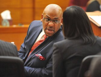 Fulton County Senior Assistant District Attorney Clint Rucker talks with another member of the prosecution team during witness statements for the defendants during sentencing proceedings for defendants convicted of racketeering and other charges in the Atlanta test-cheating trial.
