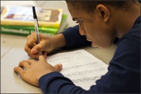 Eighth grader Mikel Robinson works on an assignment during the last unit of the school year. Students focused on how point of view affects character and plot.