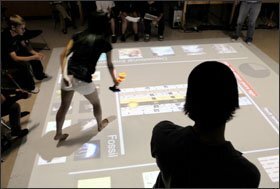 Ninth grade students at Coronado High School in Scottsdale, Ariz., walk on a mat that uses an interactive video-projection program and gaming techniques to teach academic concepts.