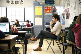 Mateo Sheedy Assistant Principal Casey Rowe sits in on a 5th grade math lesson. "The open space exacerbates the challenges of a normal classroom," he said.