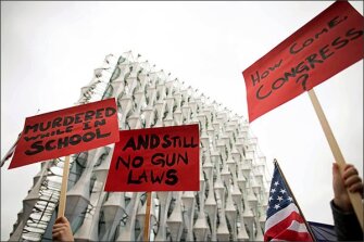 Protesters march outside the U.S. Embassy in London on March 24 in solidarity with the "March for Our Lives" protest against gun violence.