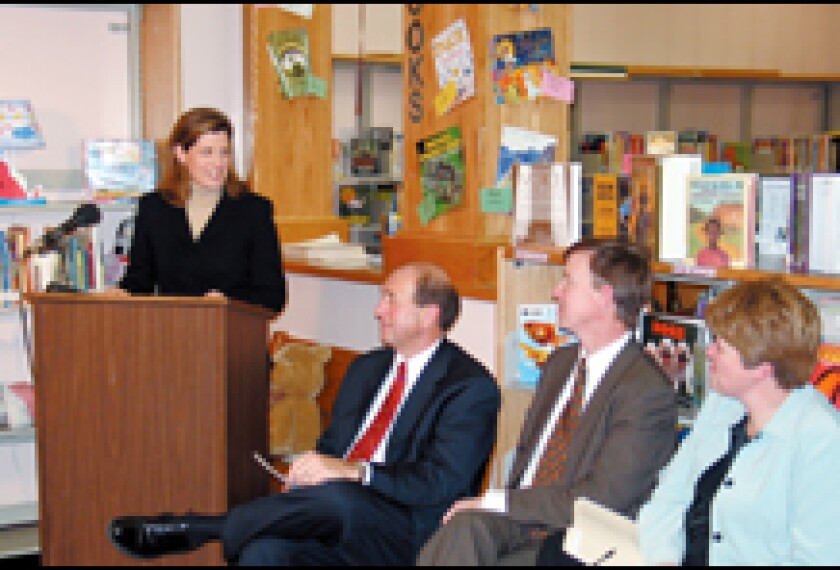 Veronica Davey of the Eli Broad Foundation announces her organization's financial support of the teacher-pay plan in Denver. 
