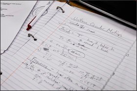 Calculations done by one of the teachers training on physics problems.