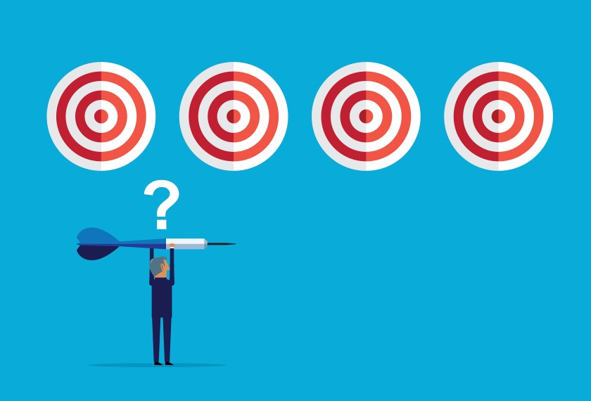 Illustration of a businessman holding a dart, with a question mark above his head, and a series of targets to choose from in background.