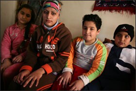 Iraqi refugees Zehra’a Hadyer, 12, far left, Shireen Fathil, 16, Sajad Hadyer, 10, and Kerrar Fathil, 11, live together in Amman, Jordan. The Fathils are the Hadyers' aunt and uncle.