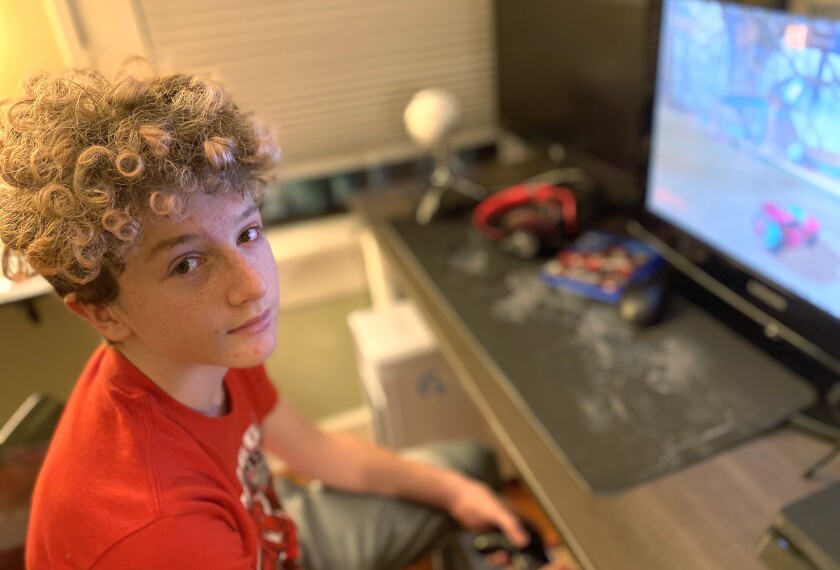 Jack Fitzgerald, 14, an 8th grader at Hogg Middle School in Houston, Texas, plays Rocket League at home this week when school was cancelled because of icy weather and widespread power outages. Jack's family had to stay with friends briefly when their home lost power and indoor temperatures plunged.