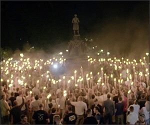 A crowd of people holds torches at a white nationalist rally in Charlottesville, Va., on Aug. 11, 2017.
