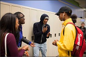 Students at the high school’s Cleveland State campus joke in the halls between classes.