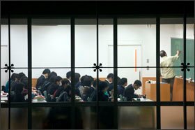 Japanese teachers, such as this Kyoto high school instructor, meet frequently with one another outside the classroom to plan lessons.
