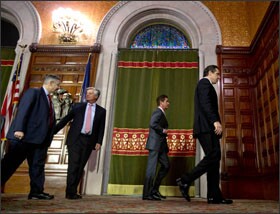 NEW YORK: Gov. Andrew M. Cuomo and legislative leaders leave a news conference at the Capitol in Albany. If New York City can't reach a deal on teacher evaluations, Mr. Cuomo says the state will impose one.