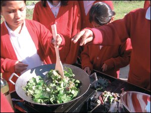 Sixth graders at Martin Luther King Jr. Academic Middle School make a vegetable stir-fry with produce they helped grow.