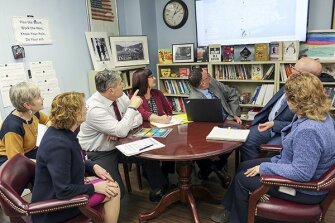 Schenectady City School District Superintendent Laurence T. Spring, third from left, and his cabinet examine a map of coronavirus cases as they determine the appropriate steps for their district in light of the virus.