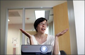 Teresa Chin teaches her students about design as part of their mobile-app class.