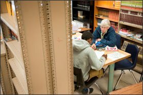 Clare Sievers, who conducts mathematics interventions at Shawnee, works with junior Javonte Richie.
