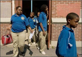 Sophie B. Wright Charter School students leave school for the day in New Orleans, La., on May 7.