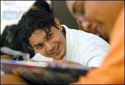 Marco Saucedo, 17, is now thinking of college as an option, in large part because of the mentoring he receives at Lancaster Elsie Robertson High School. Seniors are divvied up among staff members at the Texas school.