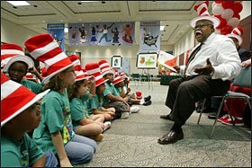 JUNE 29, 2006: While in Orlando, he takes time out to don a Dr. Suess hat and read Green Eggs and Ham to elementary school children at the convention center.