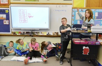Natalie Boe teaches multiplication in her 4th-grade math class at Washington Elementary School.