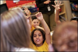 Christopher Castro, a 2nd grader at Bob Graham Education Center, waits to be called on by bankers who taught a class as part of the Great American Teach-a-Thon in Miami-Dade County, Fla.