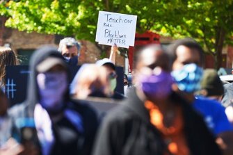 Hundreds of people gather in downtown Benton Harbor, Mich., on May 31 during a peaceful protest march held concerning police brutality and the death of black men, including George Floyd.