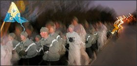 Soldiers enrolled in the Army Preparatory School jog down the streets of Fort Jackson before dawn as they participate with the rest of their company in “fun run” in military formation. Educators at the school and beyond credit the disciplined environment as a key to the school’s success at getting recruits to pass the GED.