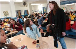 Pam Mogannam, a student adviser, monitors students at Glen Park Elementary during lunch. As part of the STAR approach, she helps students improve their behavior and avoid tardiness and absences.