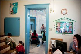 Dilcia Molina, at rear, runs a class on parenting at the Family Place in Washington. The community center would lose funding for its Even Start family-literary program under the budget the Obama administration has proposed for fiscal 2010.