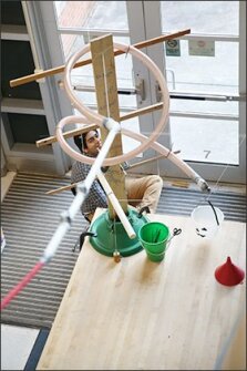 Nabeel Raza, a sophomoreat Hidden Valley High School in Roanoke, Va., mans a station of the two-story Rube Goldberg machine that students built to demonstrate their physics and calculus skills.