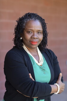 Dr. Adama Sallu stands for a portrait at Conley Elementary School on Friday, Feb. 26, 2021, in Chandler, Ariz..