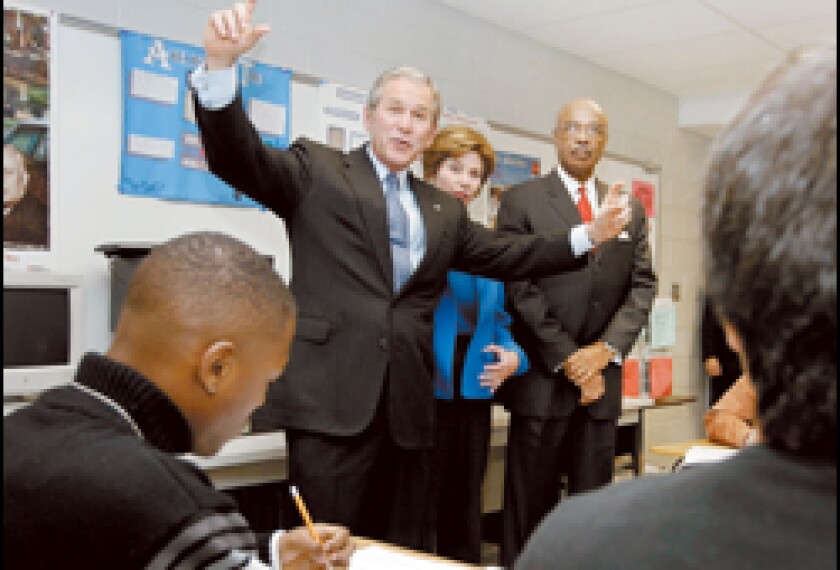 President Bush speaks to a high school class.