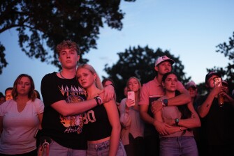 Utah Valley University students Zach Zimmerman, second from left, and Lauren Simons embrace during a vigil for Charlie Kirk, the CEO and co-founder of Turning Point USA who was shot and killed, Sept. 11, 2025, in Orem, Utah. Zimmerman witnessed the shooting.
