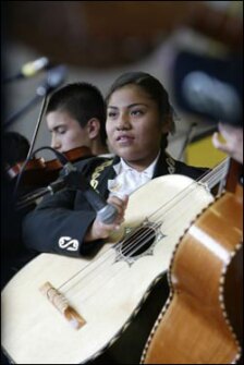 Student Eunice Aparicio and her guitarrón.