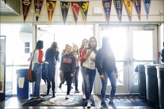 Students arrive for classes at Alliance Collins Family College-Ready High School, a public charter school in Huntington Park, Calif.
